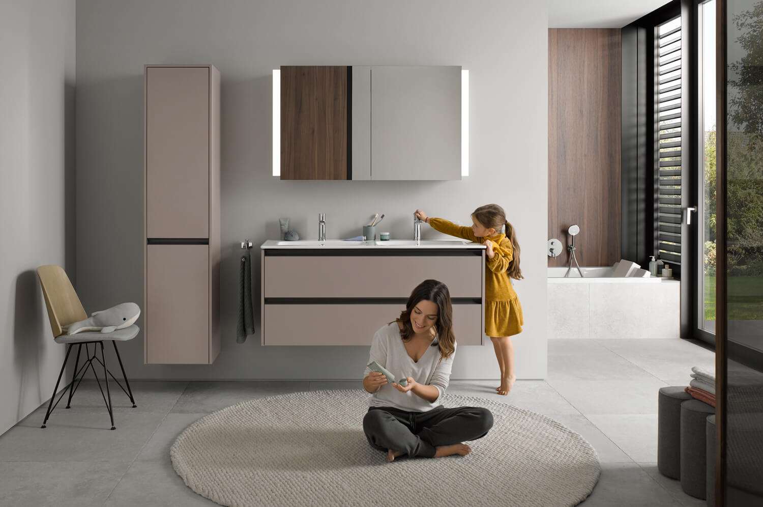 People in a modern bathroom with Ketho.2 furniture
