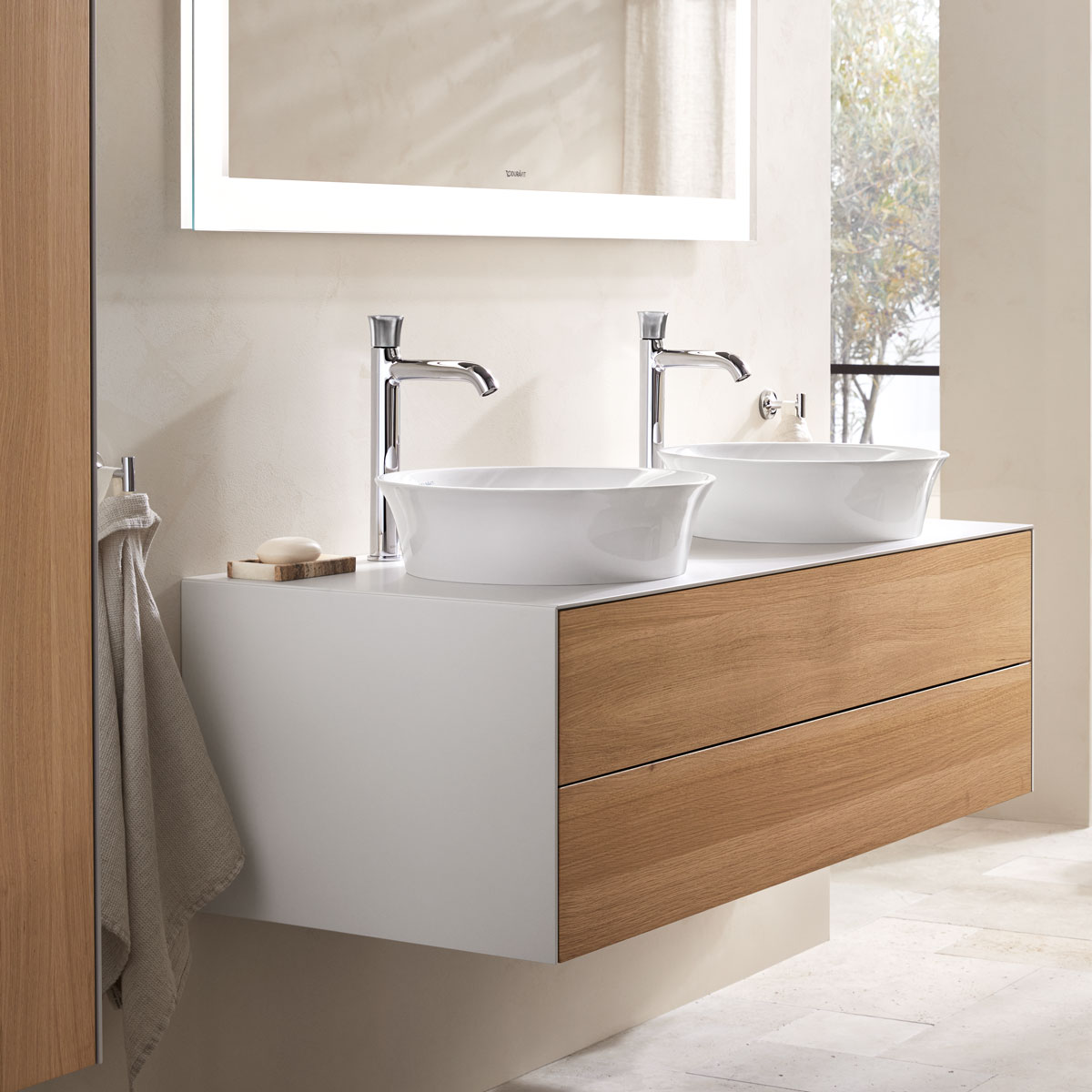Two White Tulip countertop basins with base cabinet
