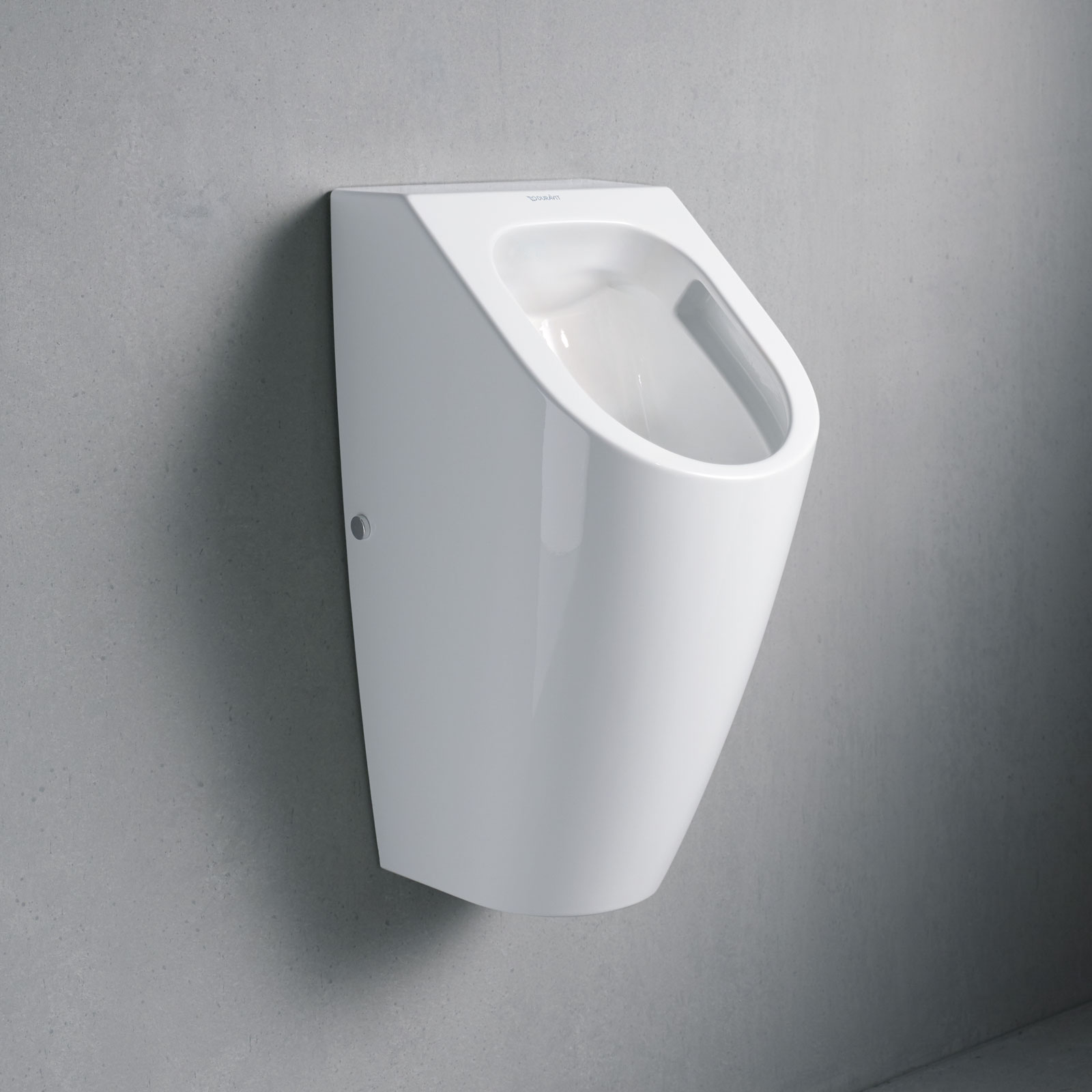 Urinal on grey wall
