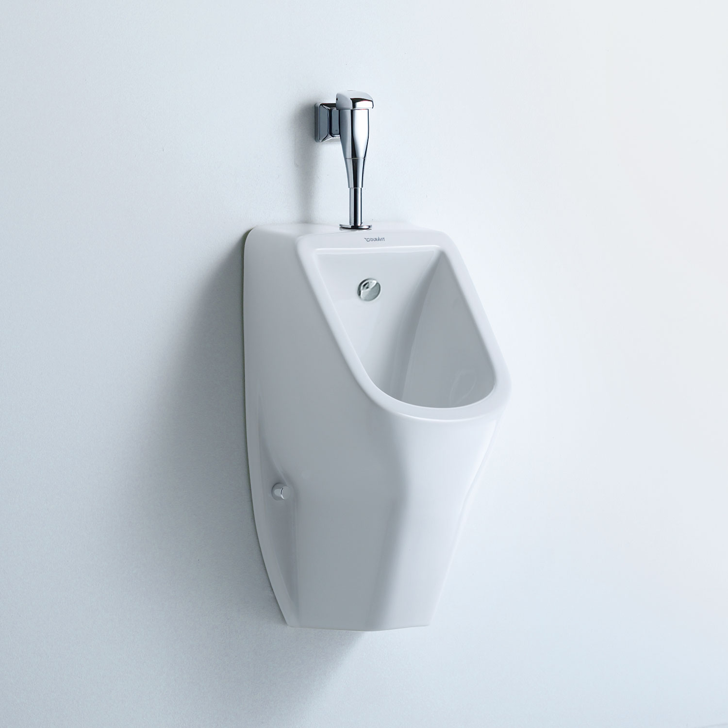 D-code urinal on white wall
