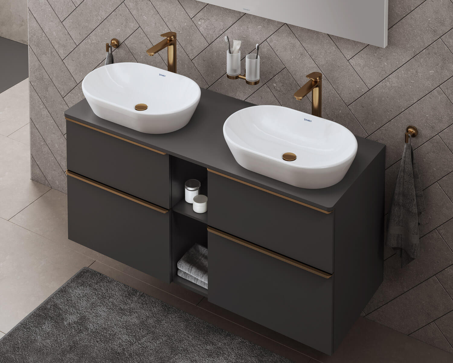 Two countertop sinks with Wave faucet in brushed bronze finish
